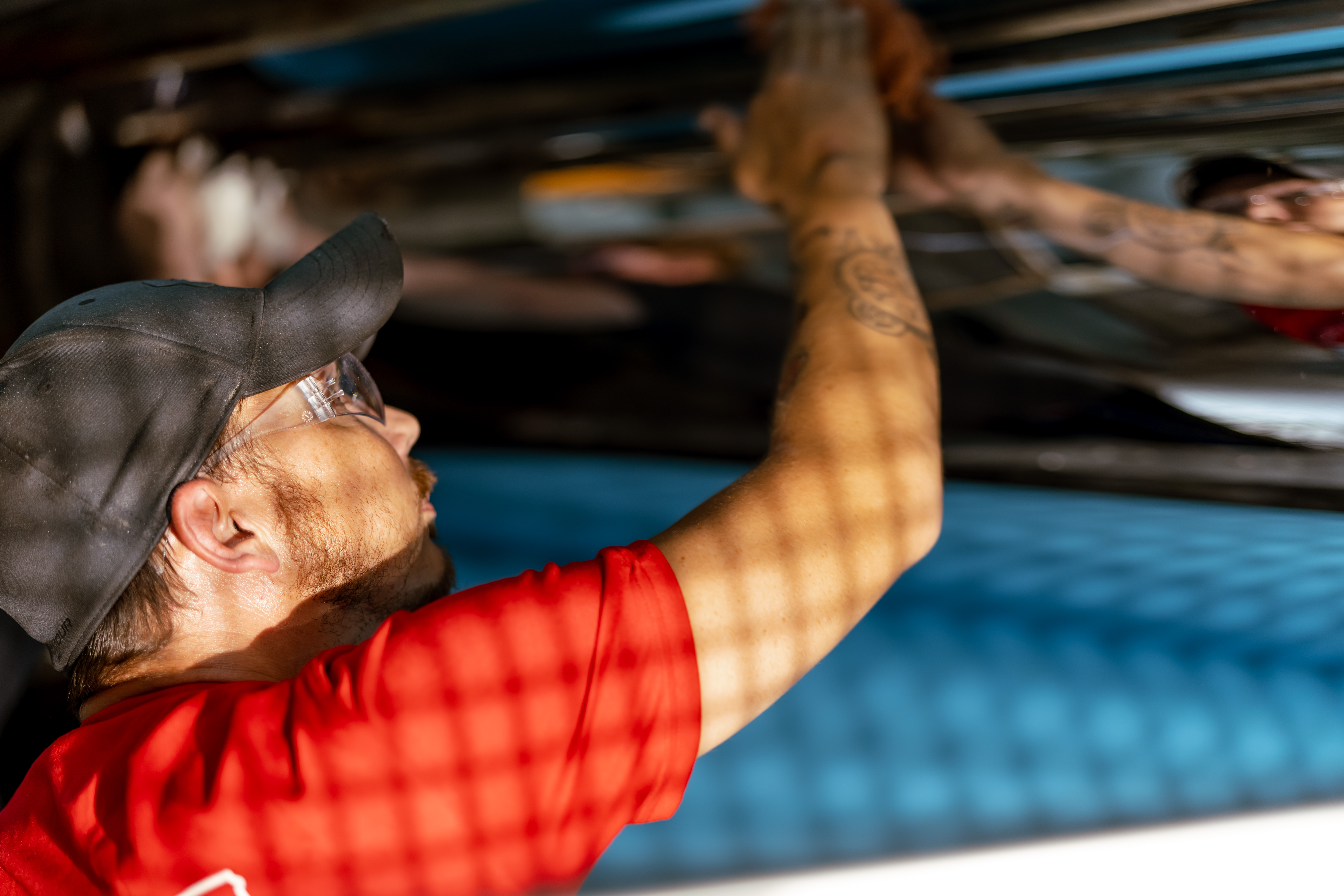 Man in red shirt working at Spencer Industries